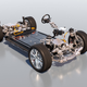 A computer rendering of the electric vehicle platform that will underpin the future Porsche Macan Electric. Visible is the battery making up the floor of the vehicle, plus four wheels and a steering column.
